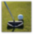 Golf club about to hit golf ball